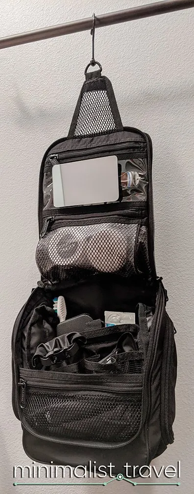 https://minimalist.travel/wp-content/uploads/LL-Bean-Personal-Organizer-Toiletry-Bag-small-black-hanging-with-everything-needed-for-6-month-trip.jpg